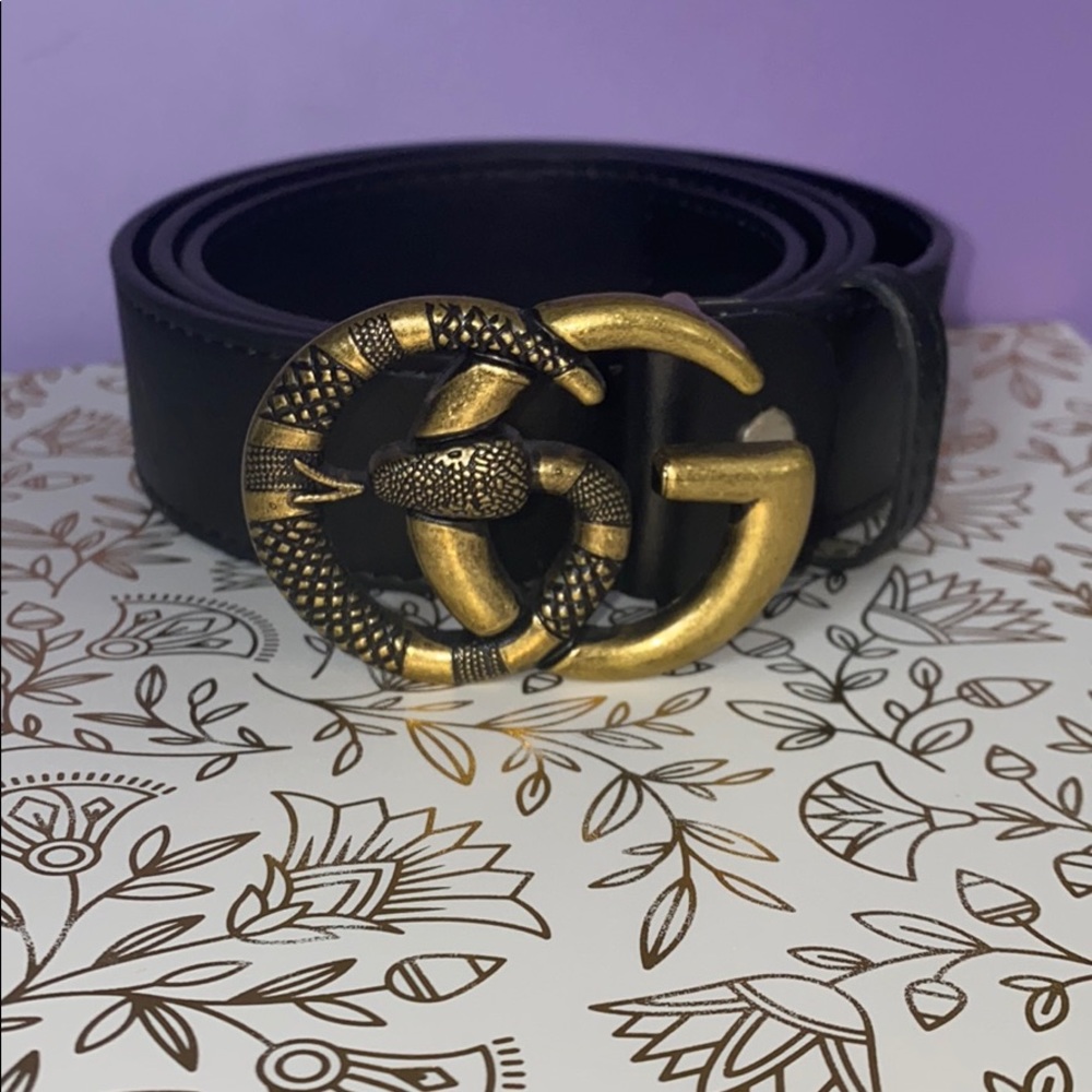 Gold buckle snake belt